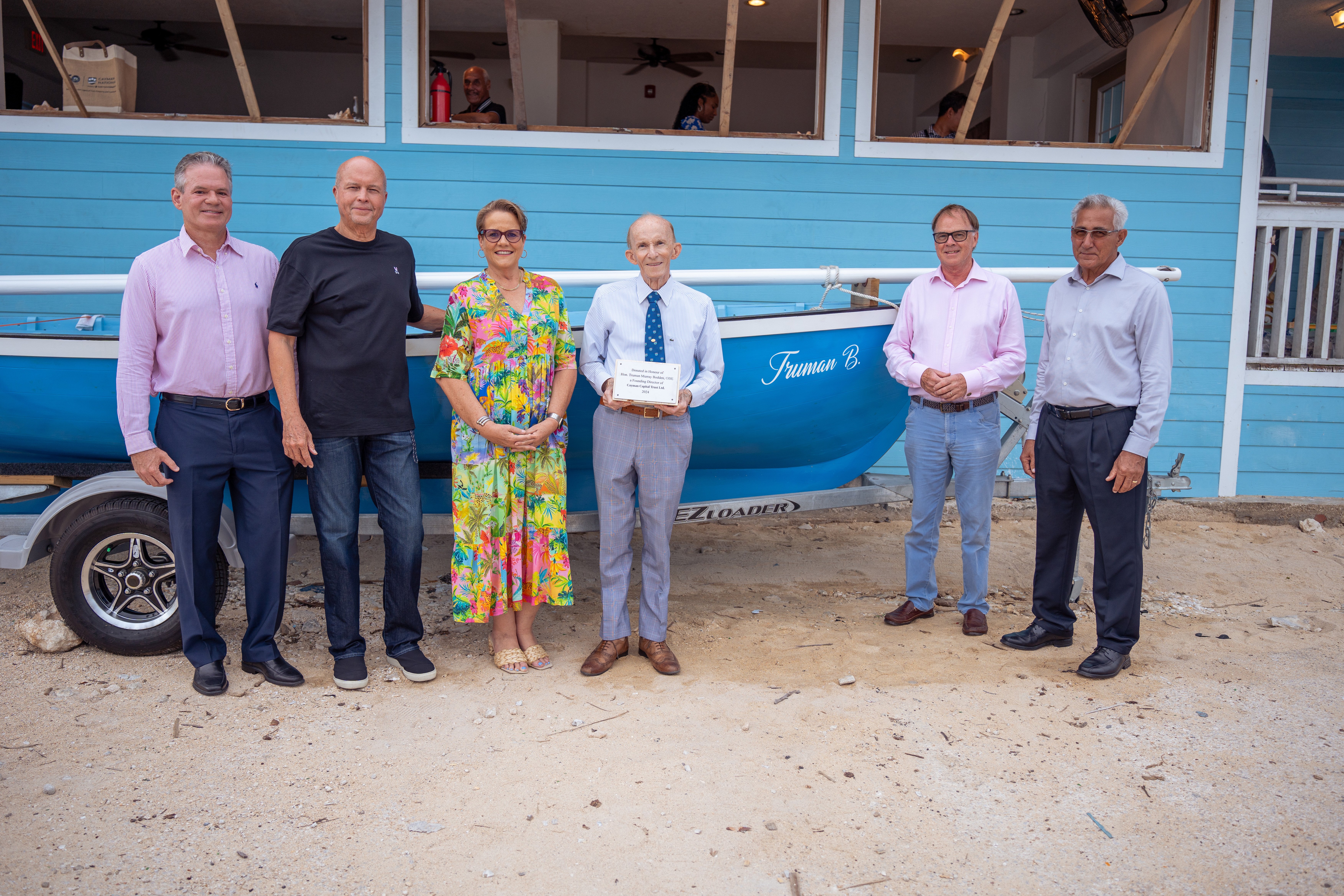 L-R: Bryan Hunter, Clarence Flowers, Janet Hislop, The Hon. Truman Bodden, Stuart Dack and Leonard Ebanks.